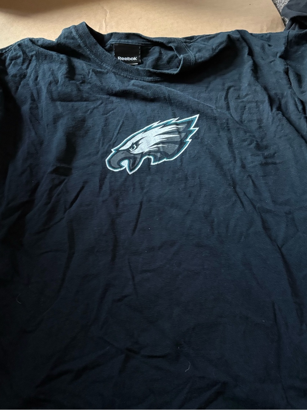 Reebok Black Tee with Teal and White Eagles Logo